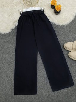 Bol Paça Beli Lastikli Bağcık Detaylı Kot Pantolon